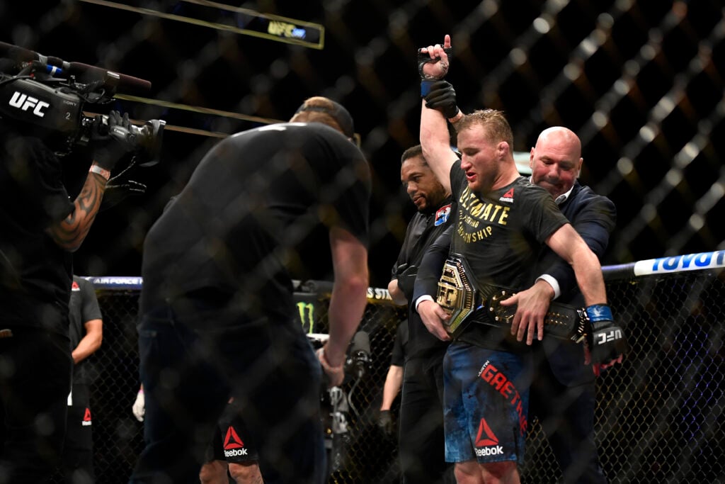 Dana White wraps the interim lightweight title around Justin Gaethje at UFC 249