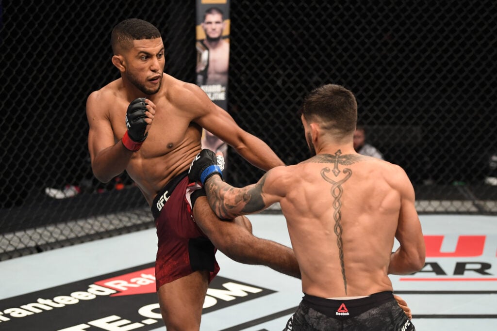 Youssef Zalal landing a kick on Ilia Topuria