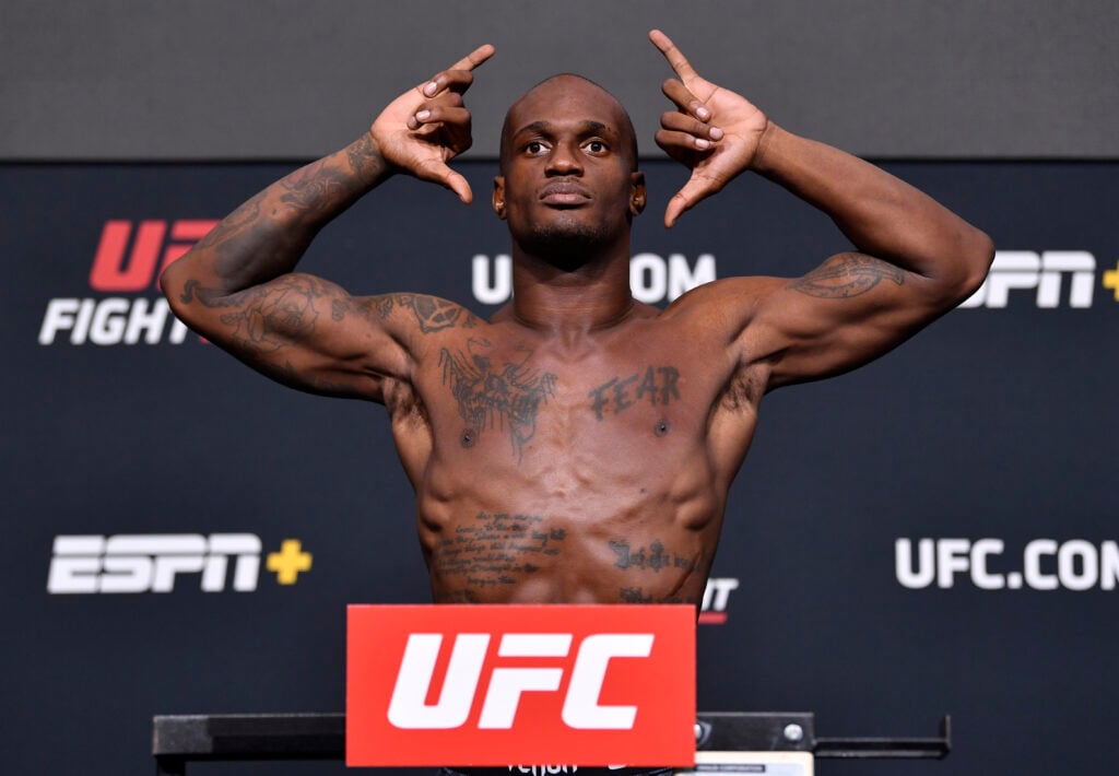 Jared Gooden poses on the scale at UFC weigh-ins
