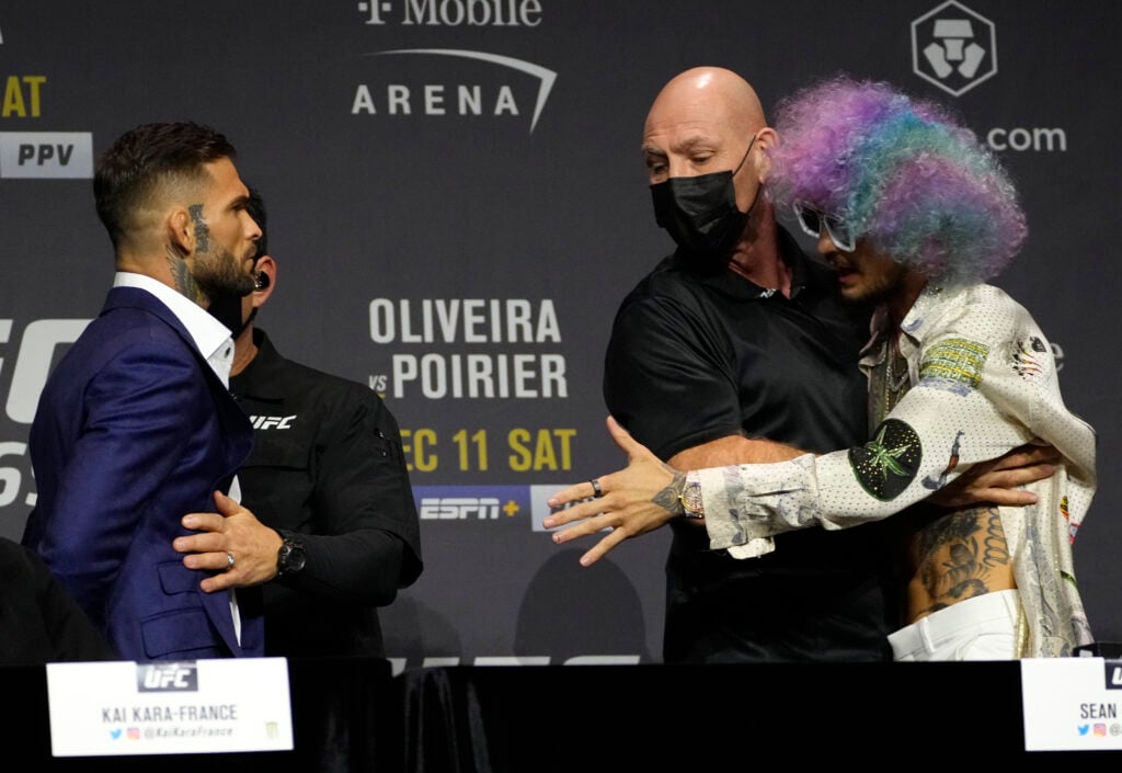 Cody Garbrandt and Sean O'Malley are separated during an altercation at the UFC 269 press conference