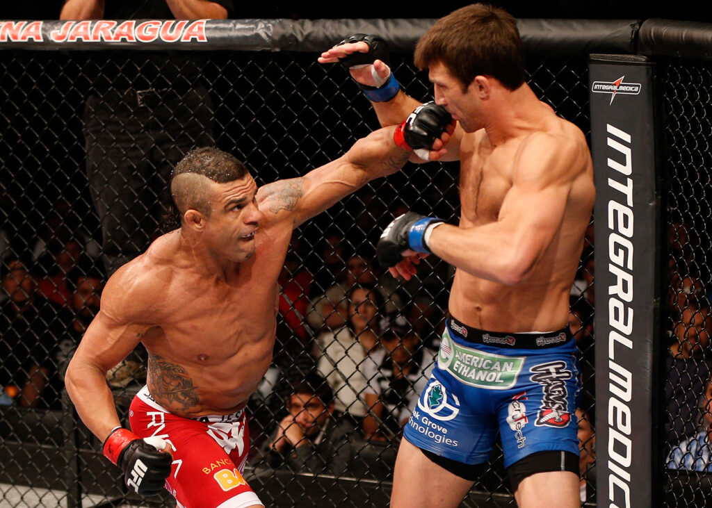 Vitor Belfort lands left hand on Luke Rockhold during UFC fight
