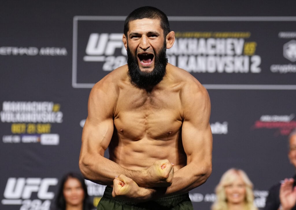 Khamzat Chimaev poses on the scale during the UFC 294 ceremonial weigh-in in Abu Dhabi