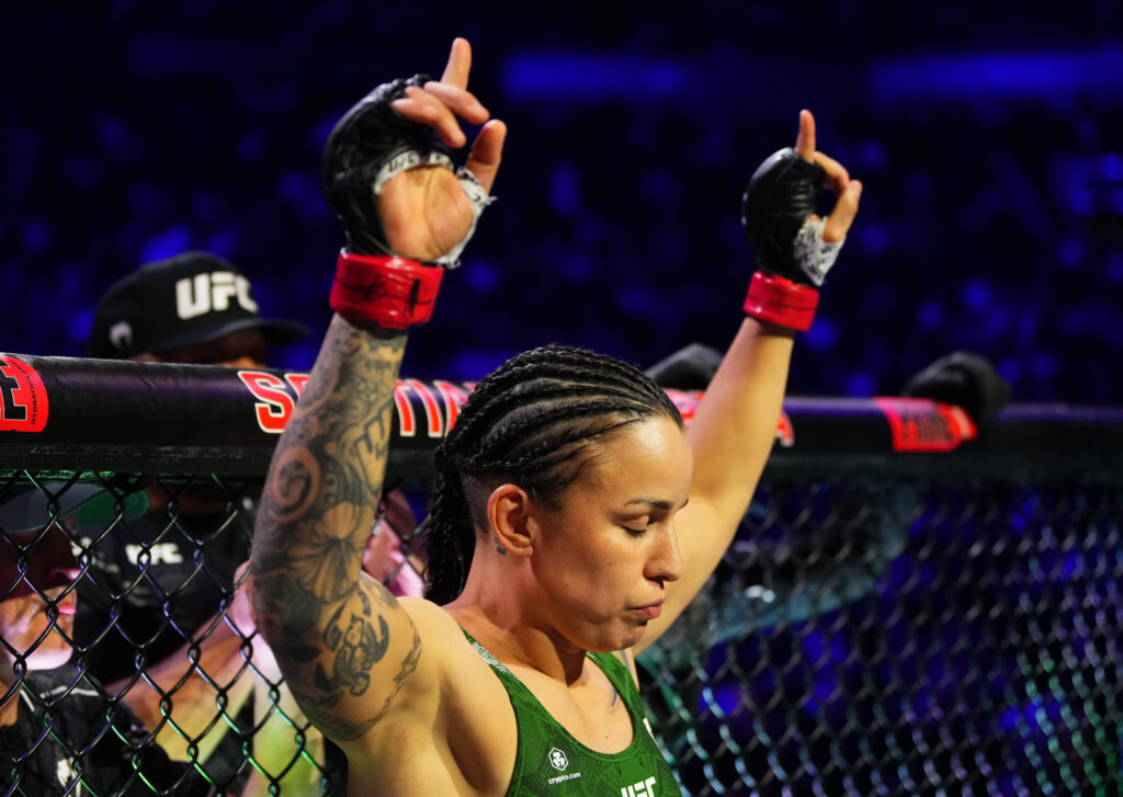 Raquel Pennington reacts during her introduction in the cage at UFC 297