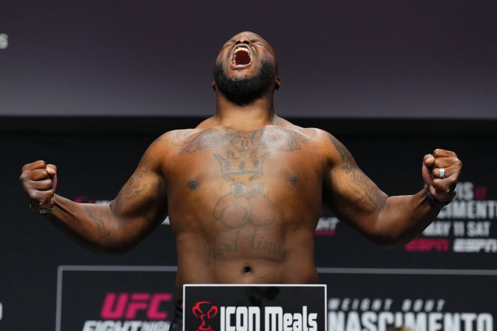 Derrick Lewis screams and poses on the scale during the weigh in for his fight against Rodrigo Nascimento