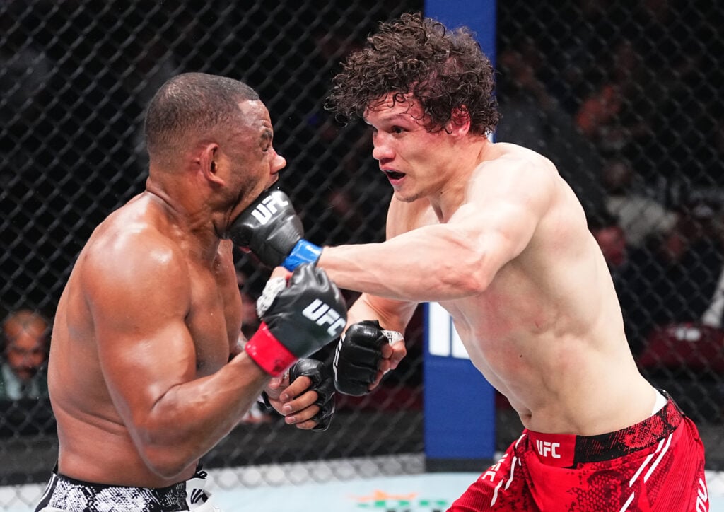 Roman Kopylav lands a left handed punch on Cesar Almeida during their fight at UFC 302