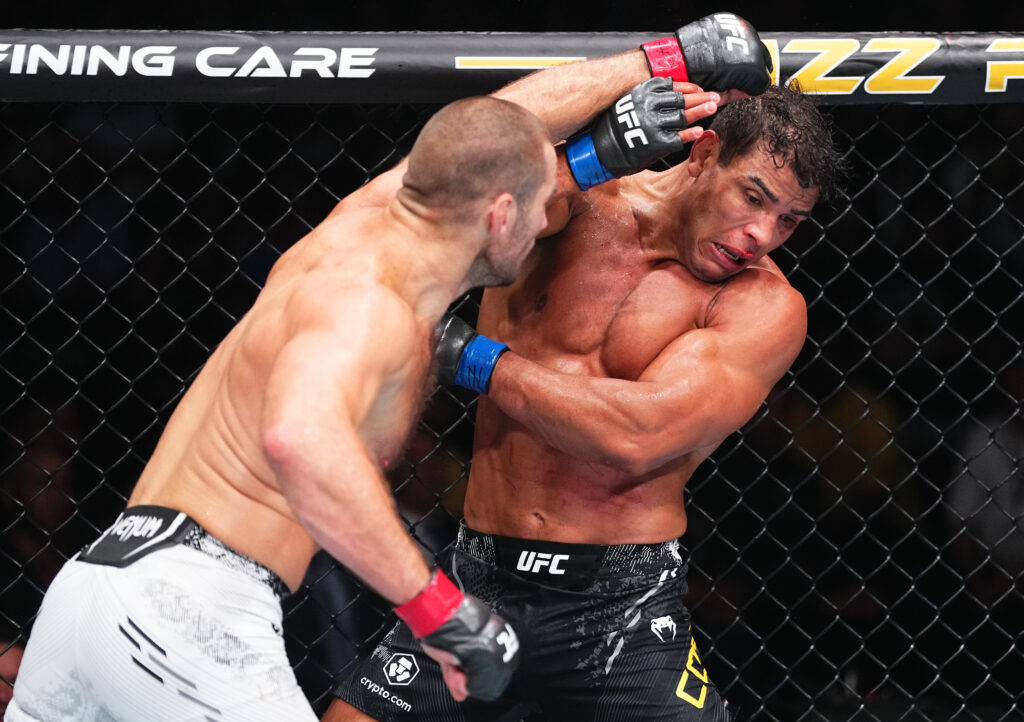 Sean Strickland punches Paulo Costa during their fight at UFC 302.