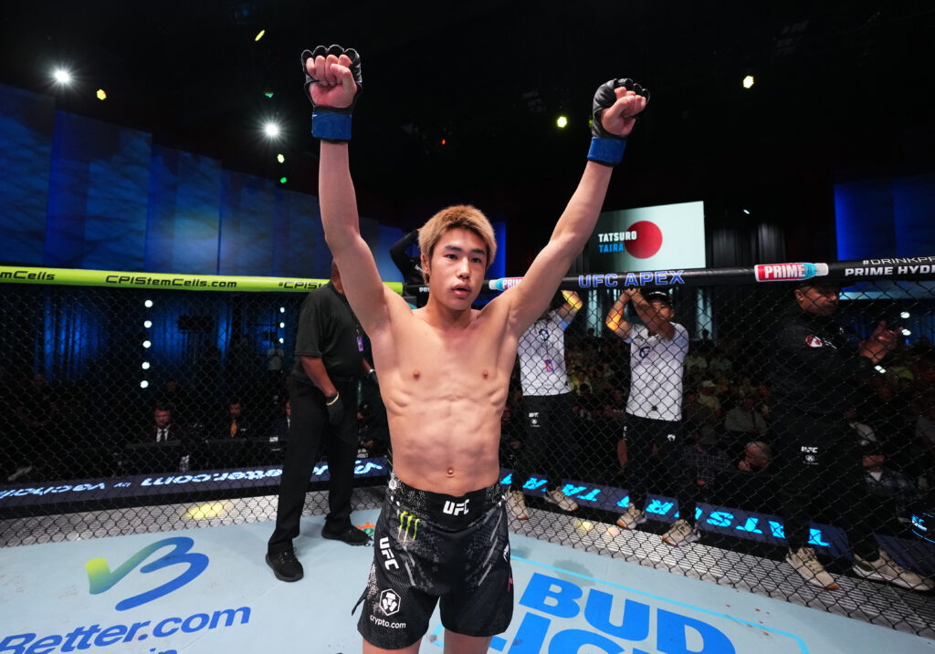 Tatsuro Taira lifts his arms in the air before his fight with Brandon Royval
