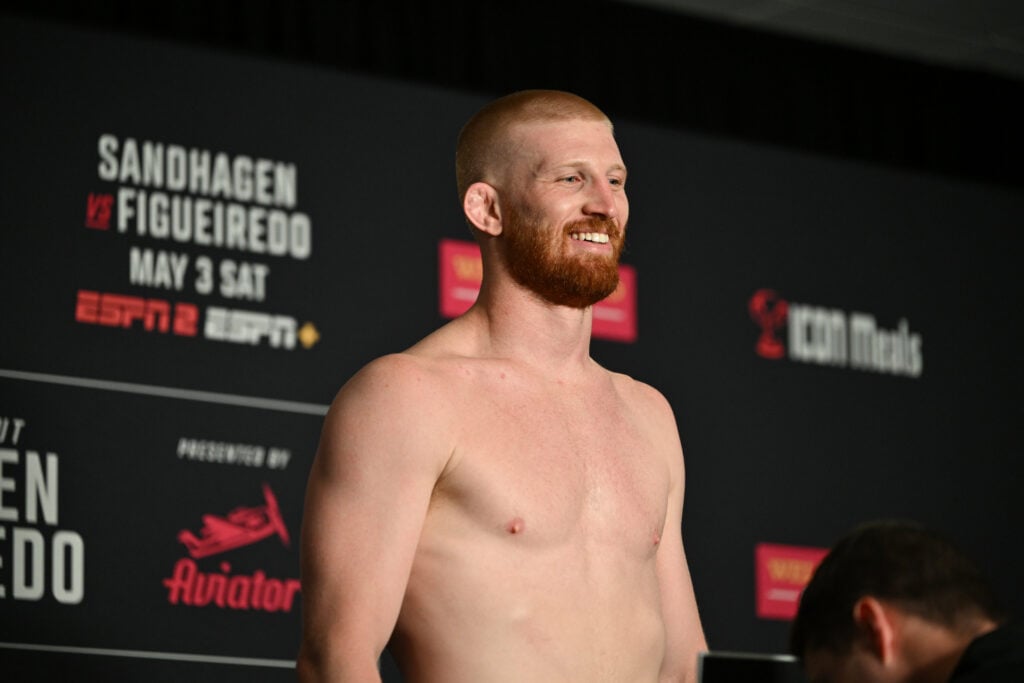 Bo Nickal poses on the scale at the UFC Des Moines official weigh-in