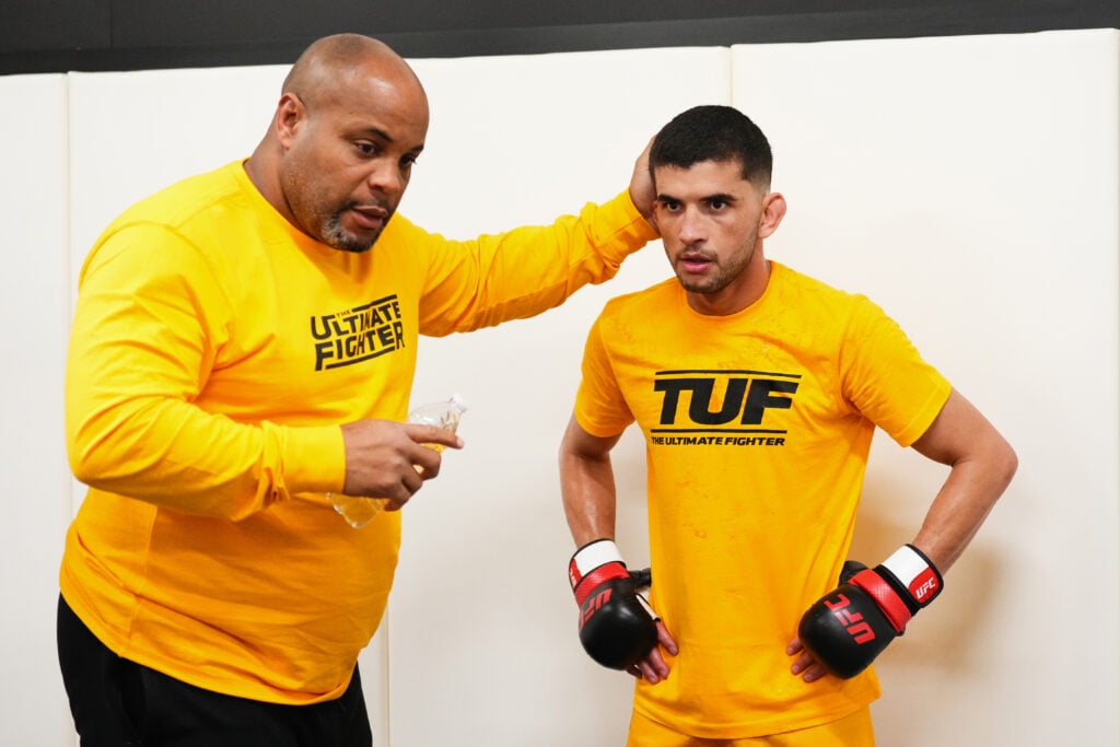 Daniel Cormier coaches a fighter on the set of The Ultimate Fighter