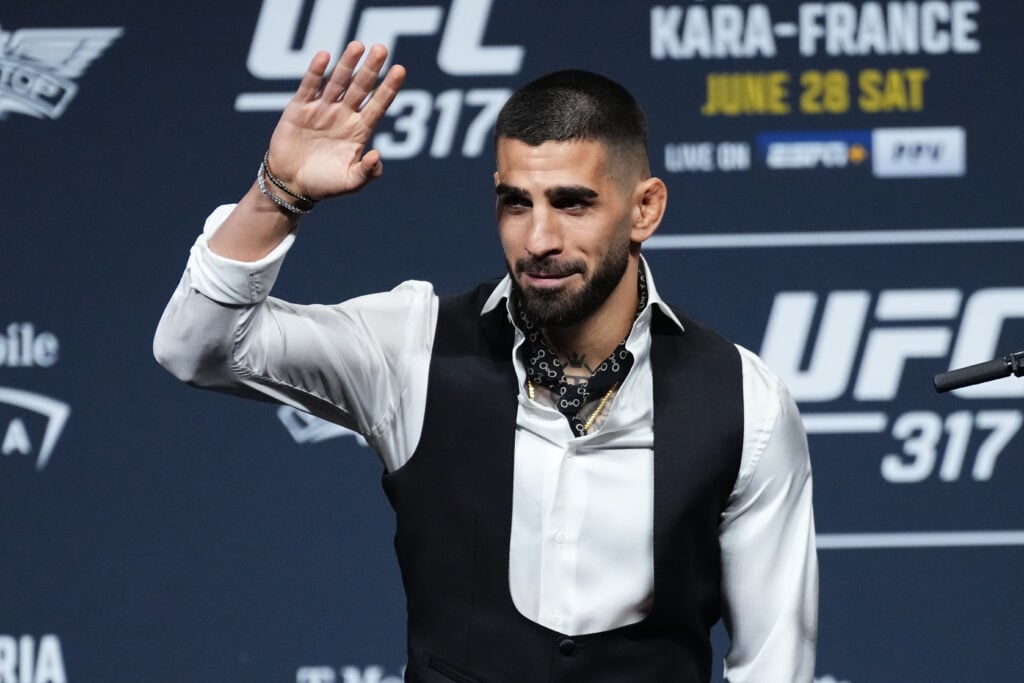 Ilia Topuria acknowledges the crowd at the UFC 317 pre-fight press conference