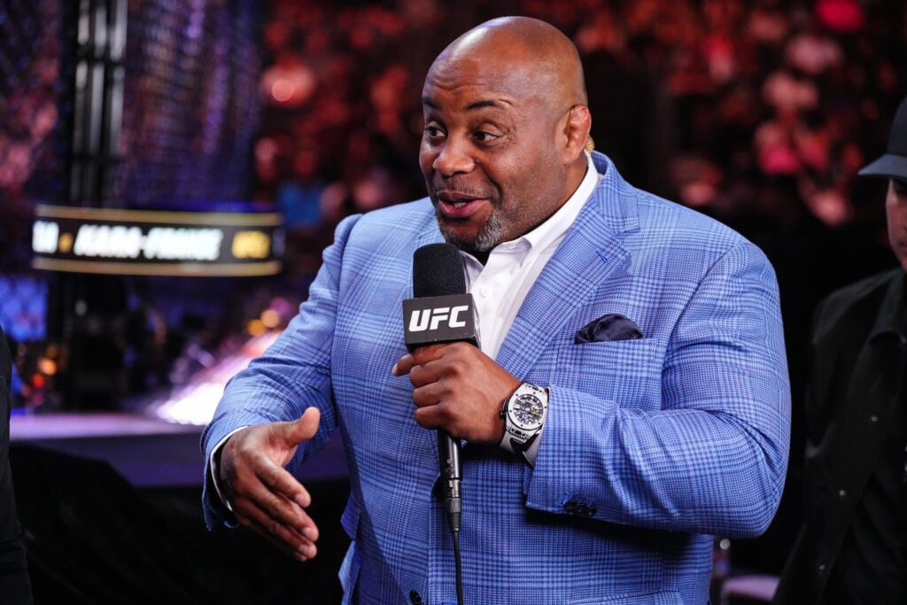 Daniel Cormier commentates during a live segment at UFC 317