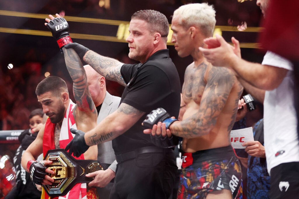 Ilia Topuria getting the win over Charles Oliveira at UFC 317