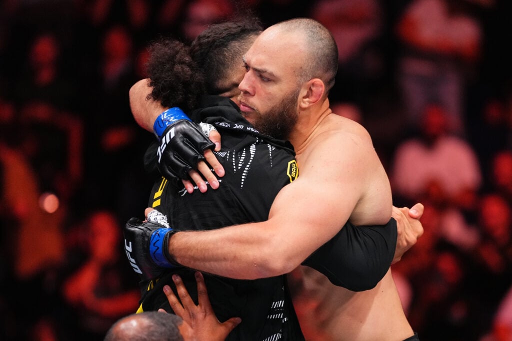 UFC heavyweight Valter Walker embraces brother Johnny after his submission win at UFC Nashville