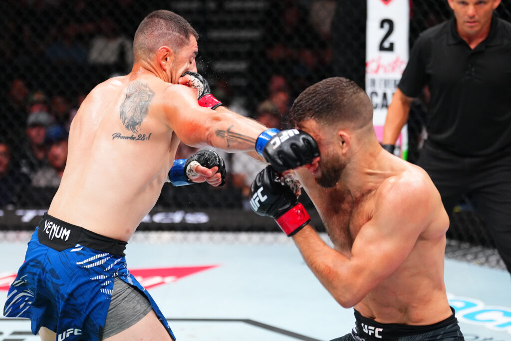 Calvin Kattar and Steve Garcia trade punches during their fight at UFC Nashville