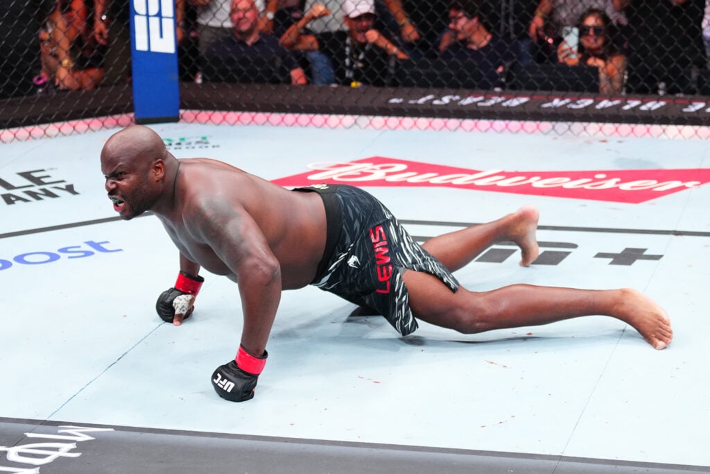 Derrick Lewis celebrates in the Octagon after a knockout win at UFC Nashville