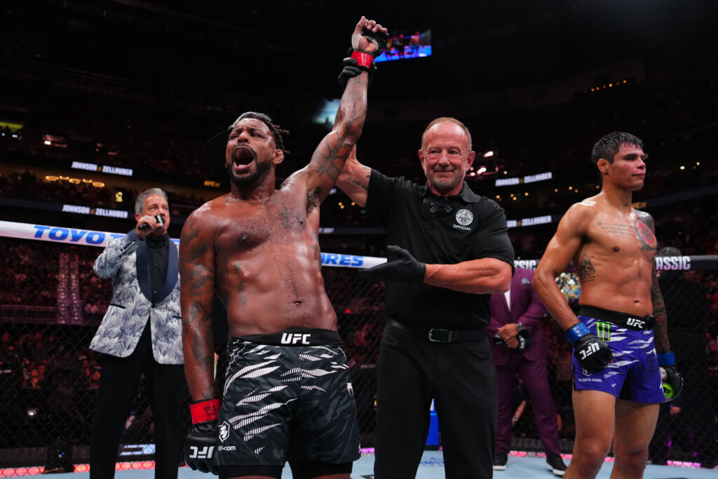 Michael Johnson gets his hand raised after defeating Daniel Zellhuber at UFC 318