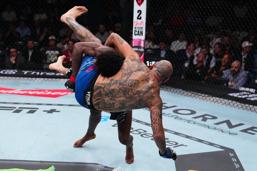Kevin Holland takes down Daniel Rodriguez during their welterweight bout at UFC 318