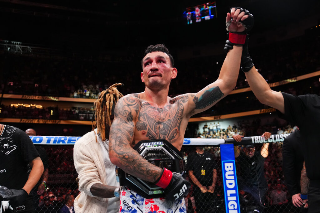 Max Holloway celebrates his UFC 318 BMF title defense