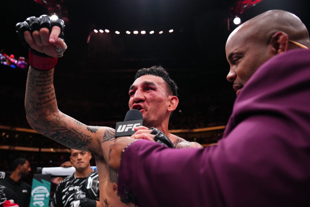 Max Holloway talking to Daniel Cormier following UFC 318 win