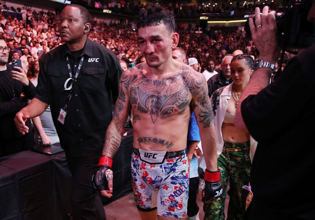 Max Holloway leaves the Octagon after defeating Dustin Poirier in their BMF title fight at UFC 318.
