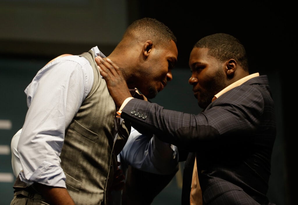 Anthony Johnson shoves Jon Jones during a press conference faceoff