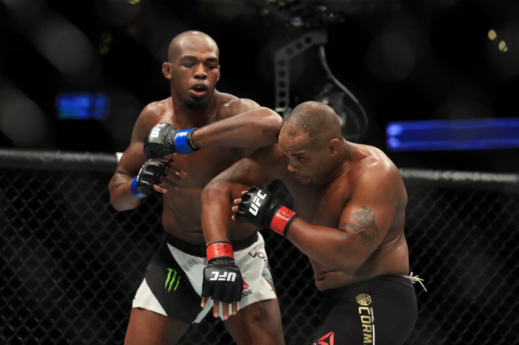 Jon Jones throws an elbow at Daniel Cormier during their second fight at UFC 217