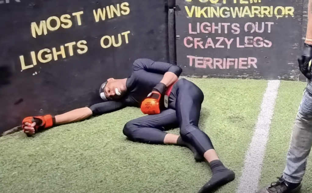 Death Sentence on the floor after being KO'd by Zack Cray