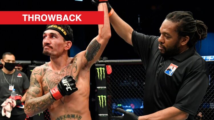 Max Holloway gets his hand raised after beating Calvin Kattar.