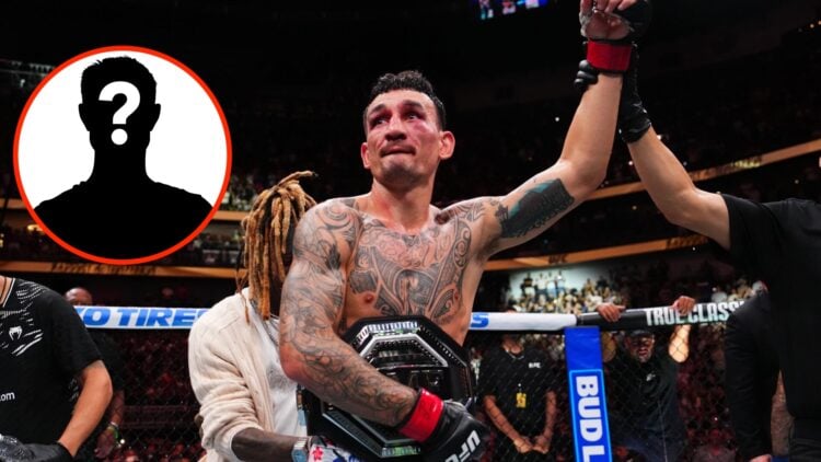 Max Holloway celebrates with his BMF title after UFC 318 win over Dustin Poirier
