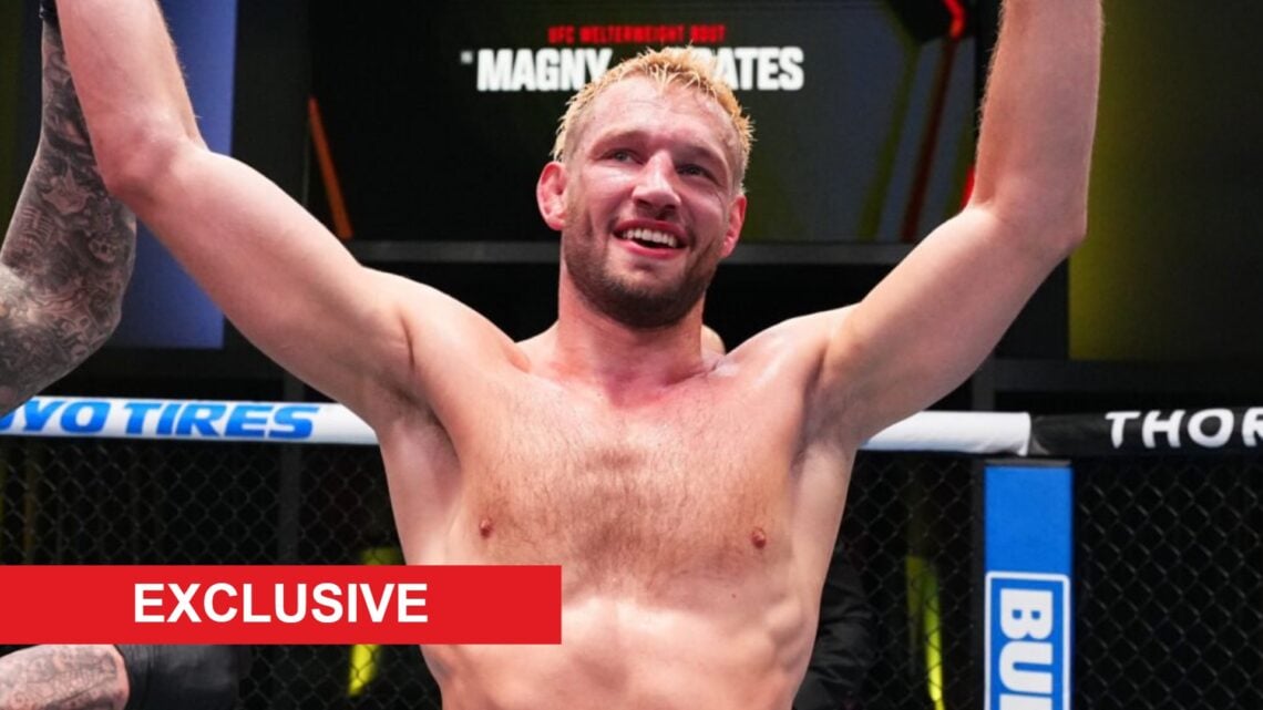 Reinier de Ridder celebrates after beating Gerald Meerschaert at the UFC Apex, with exclusive banner