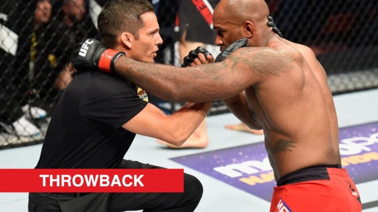Jason Herzog helps Jimi Manuwa after he was knocked out by Volkan Oezdemir in their fight at UFC 214
