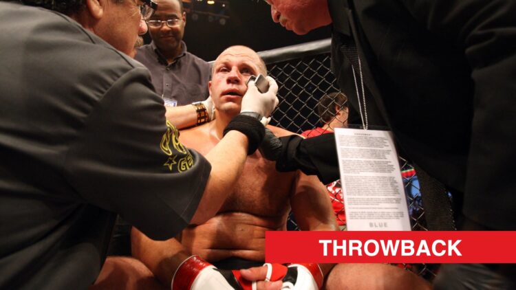 Fedor Emelianenko receives attention from his cut man following TKO loss to Dan Henderson