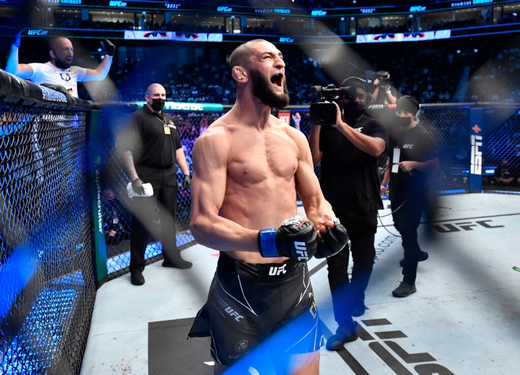 Khamzat Chimaev celebrates in the octagon at UFC 267