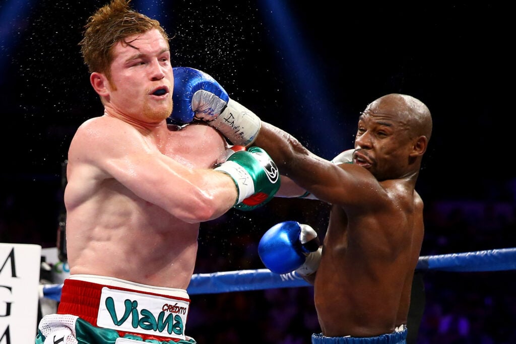 Floyd Mayweather lands a left hand on Canelo Alvarez during title fight