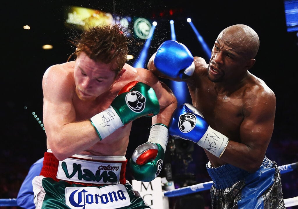 Floyd Mayweather lands a right hand on Canelo Alvarez during boxing fight