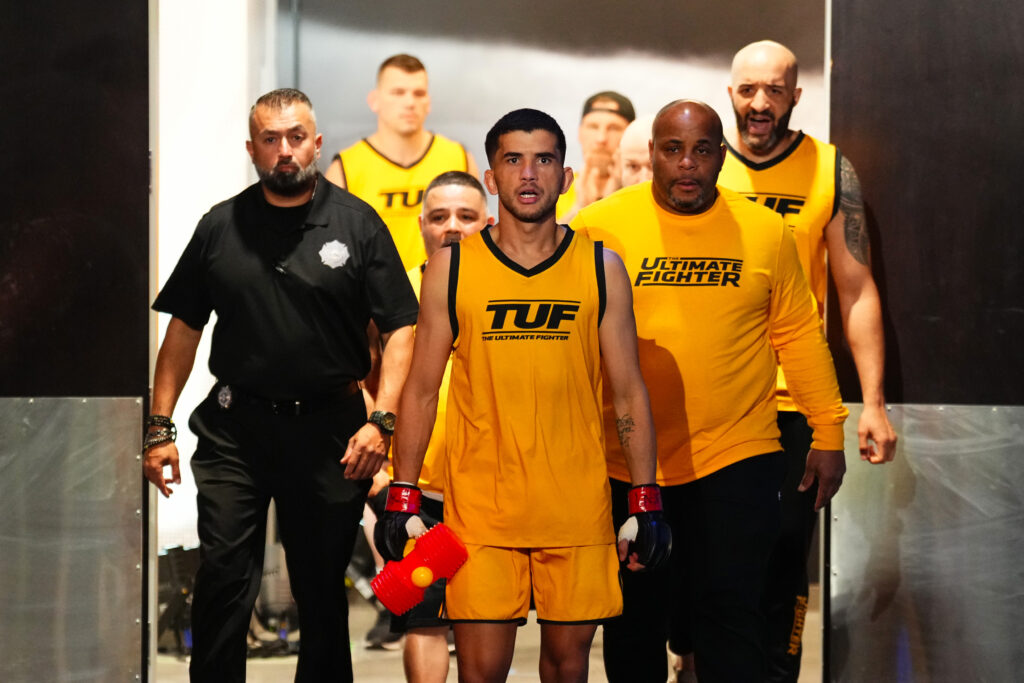 Eduardo Henrique walking out with Daniel Cormier on The Ultimate Fighter 33