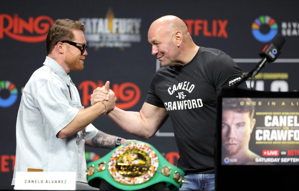 Canelo Alvarez greets Dana White on stage at the press conference for the Mexican's fight against Terence Crawford