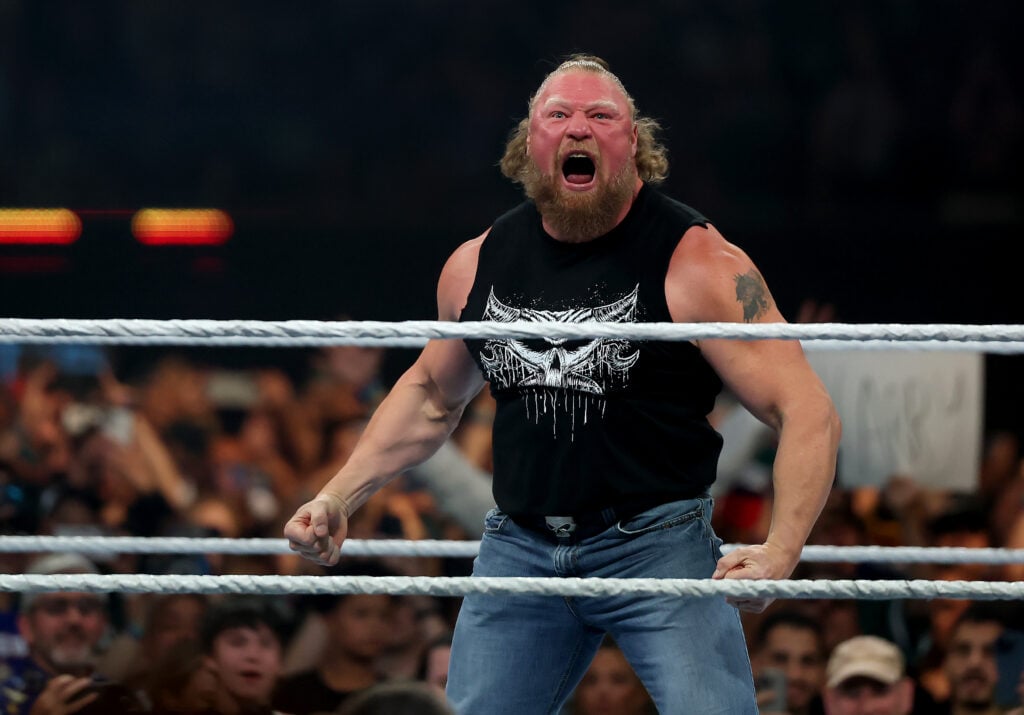 Brock Lesnar celebrates after slamming John Cena during the WWE 2025 SummerSlam at MetLife Stadium