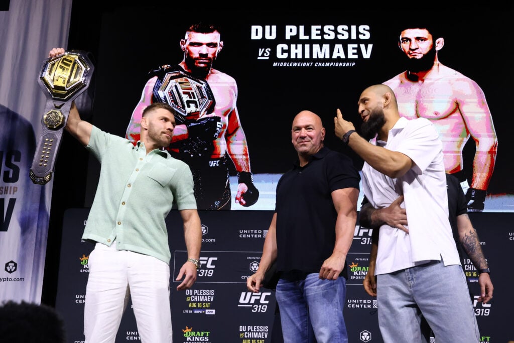 Dricus du Plessis holding UFC belt while facing Khamzat Chimaev at the UFC 319 Press Conference