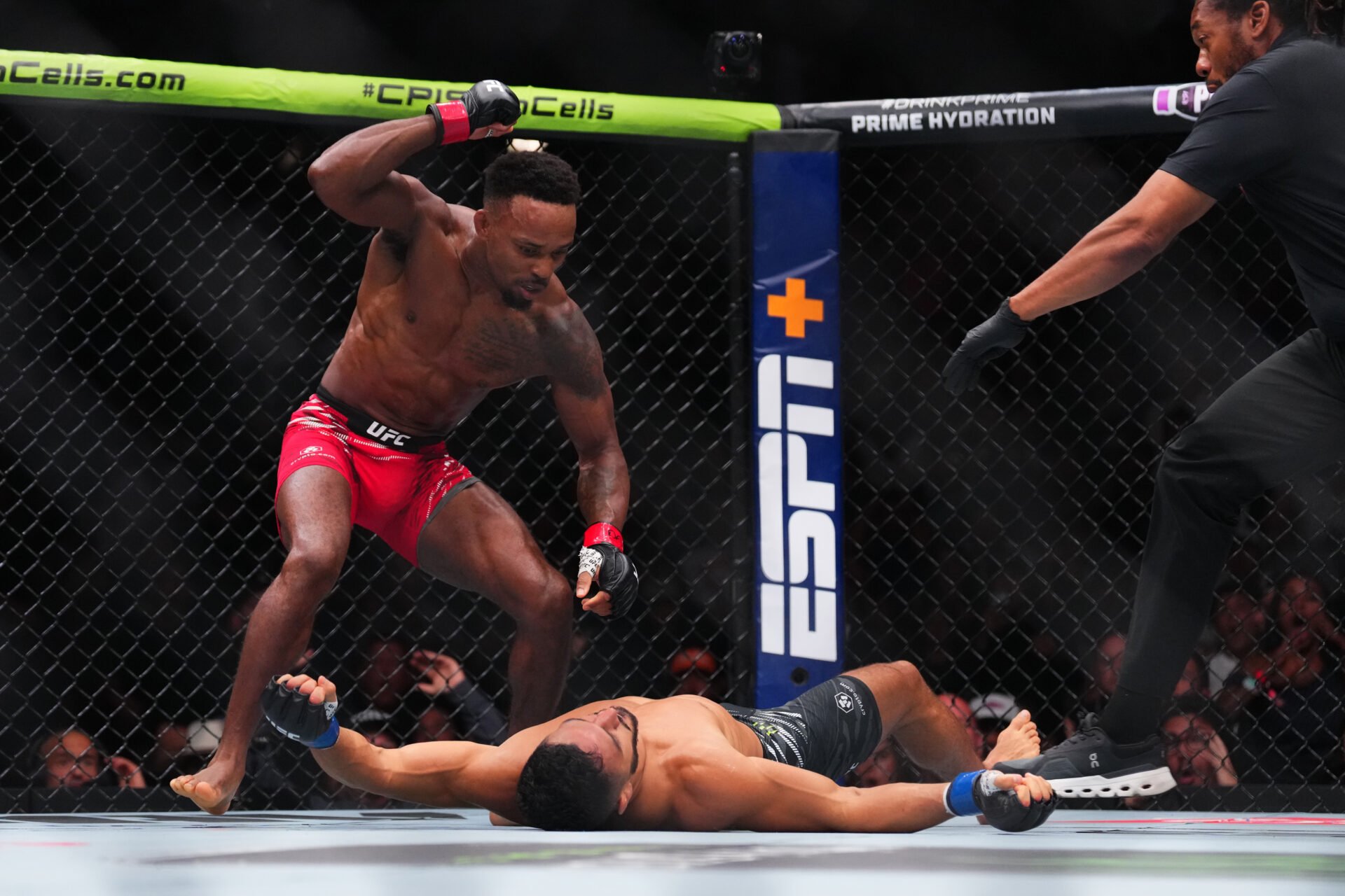 Lerone Murphy stands over Aaron Pico throwing a punch to his unconscious body