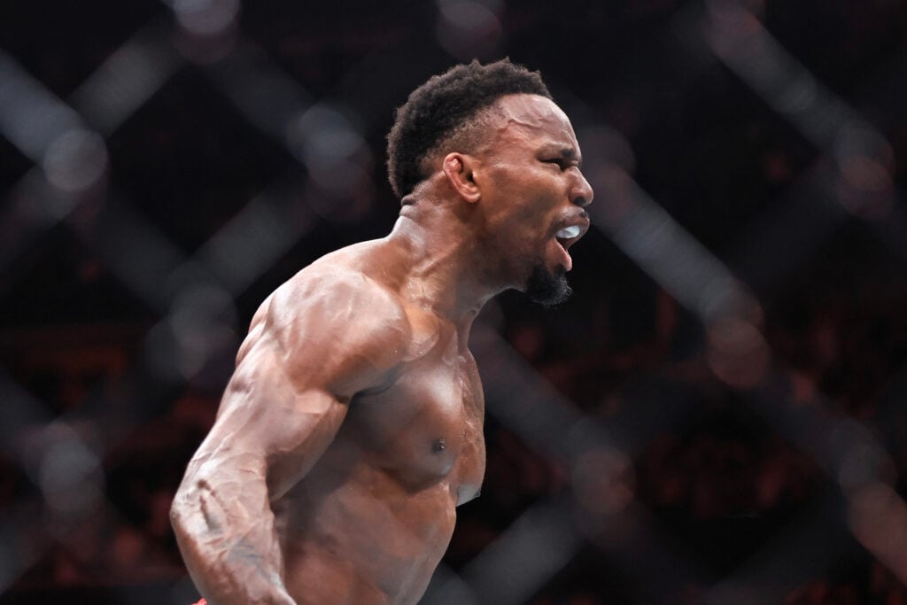 Lerone Murphy celebrates in the Octagon after his knockout win over Aaron Pico at UFC 319 in Chicago, Illinois