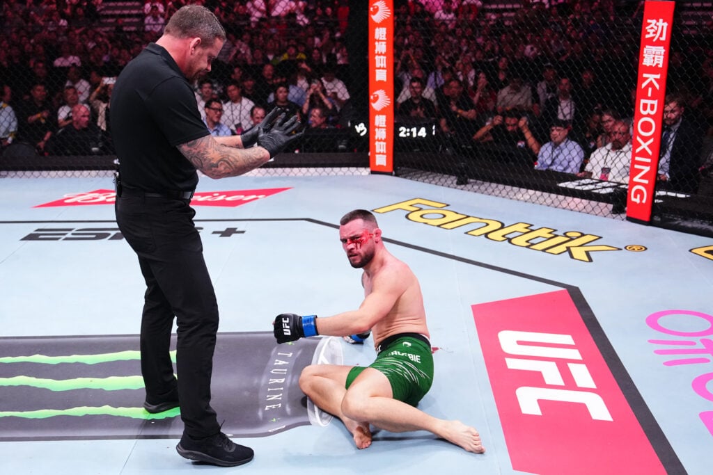 Kiefer Crosbie reacts after suffering illegal knee during UFC Shanghai