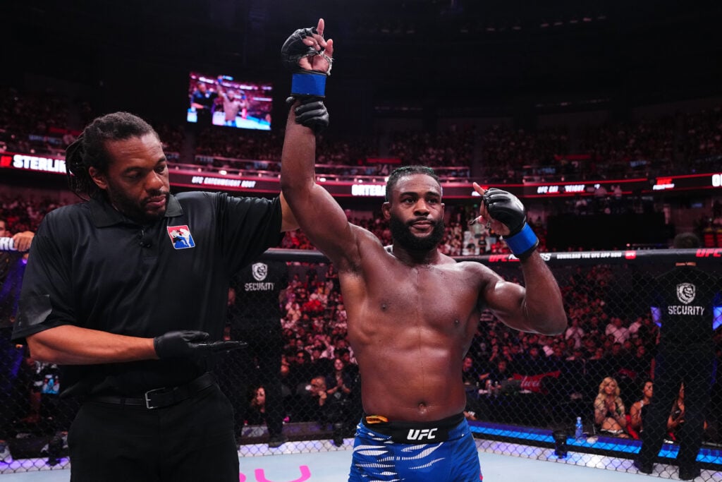 Aljamain Sterling gets his hand raised after beating Brian Ortega