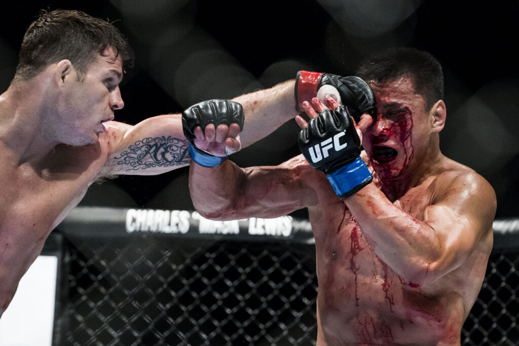 Michael Bisping punches Cung Le during their fight at UFC Macau