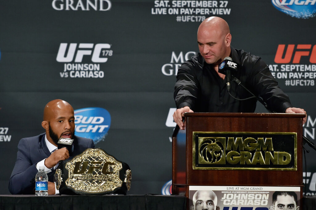 Dana White looking at Demetrious Johnson during the UFC 178 press conference