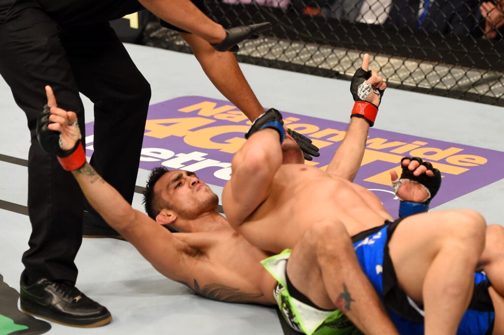 Tony Ferguson celebrates after submitting Gleison Tibau at UFC 184