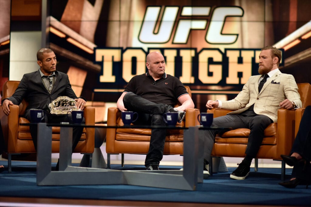 Dana White sits between Conor McGregor and Jose Aldo at UFC on Fox