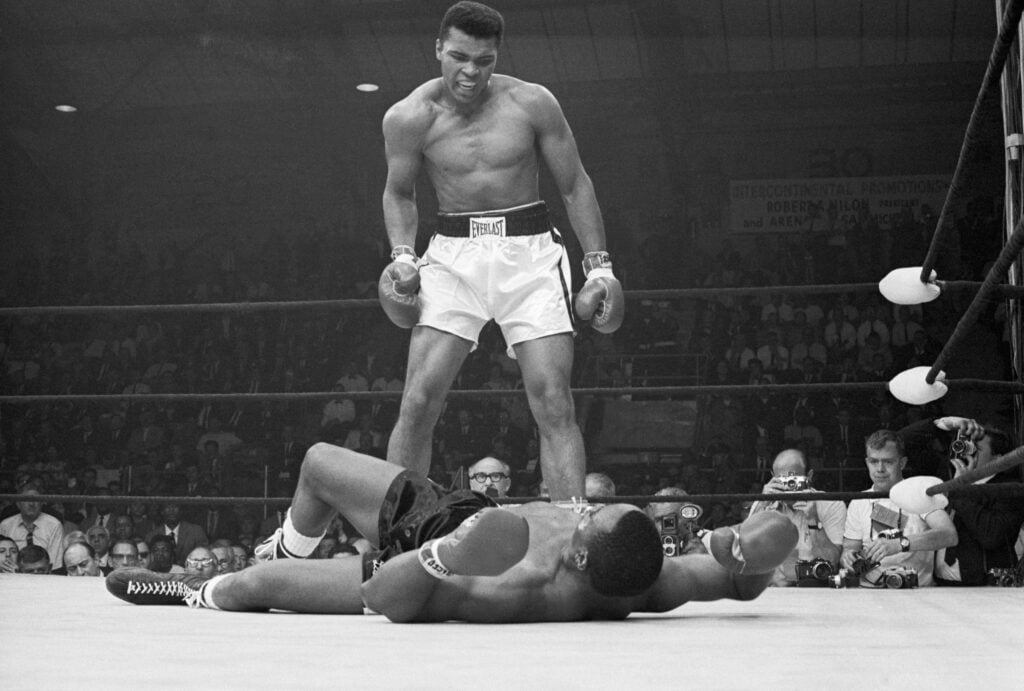 Muhammad Ali taunts Sonny Liston after knocking him out to win their rematch