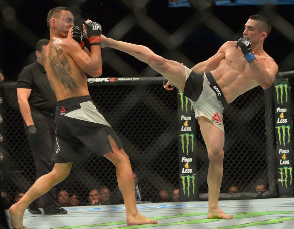 Ricardo Lamas lands head kick on Max Holloway at UFC 199