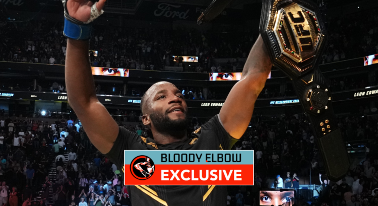 Leon Edwards holds aloft the UFC title belt